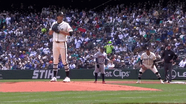 An animated GIF of Logan Gilbert picking off Jose Altuve