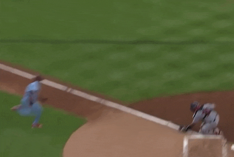An animated GIF of Luis Arraez trying to avoid a tag