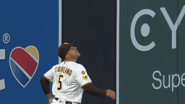 An animated gif of Ramón Laureano making a leaping catch at the wall at Petco Park