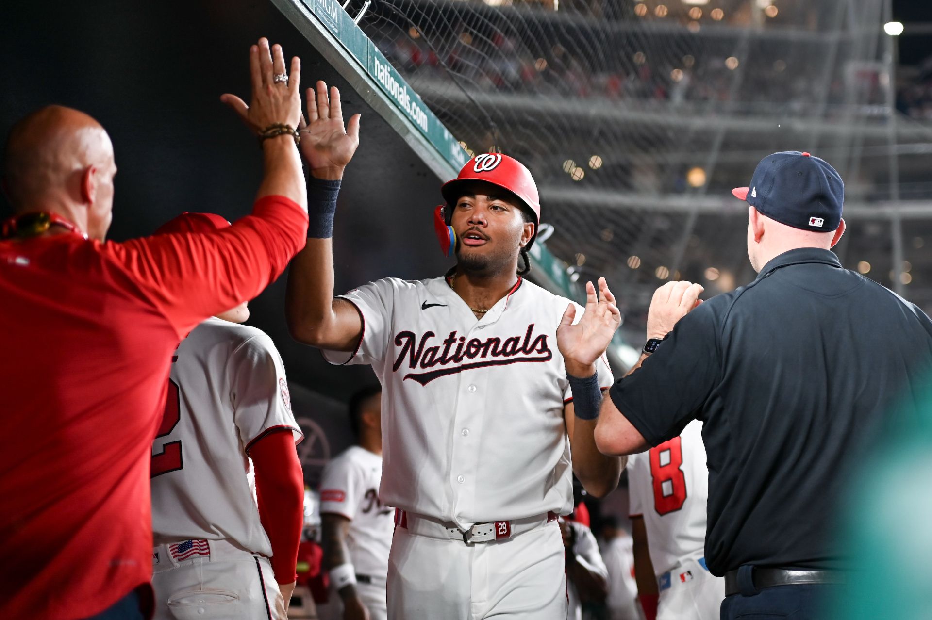 James Wood celebrates in the Nationals' dugout