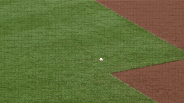 An animated gif of Ryan O'Hearn making a between-the-legs throw for an out