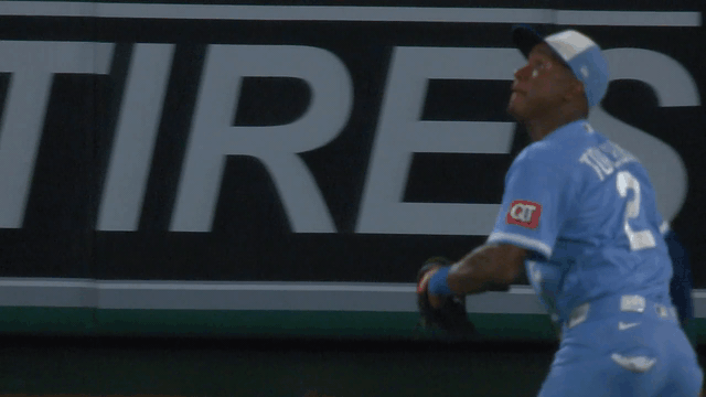 An animated gif of Royals outfielder Tyler Tolbert making a diving catch