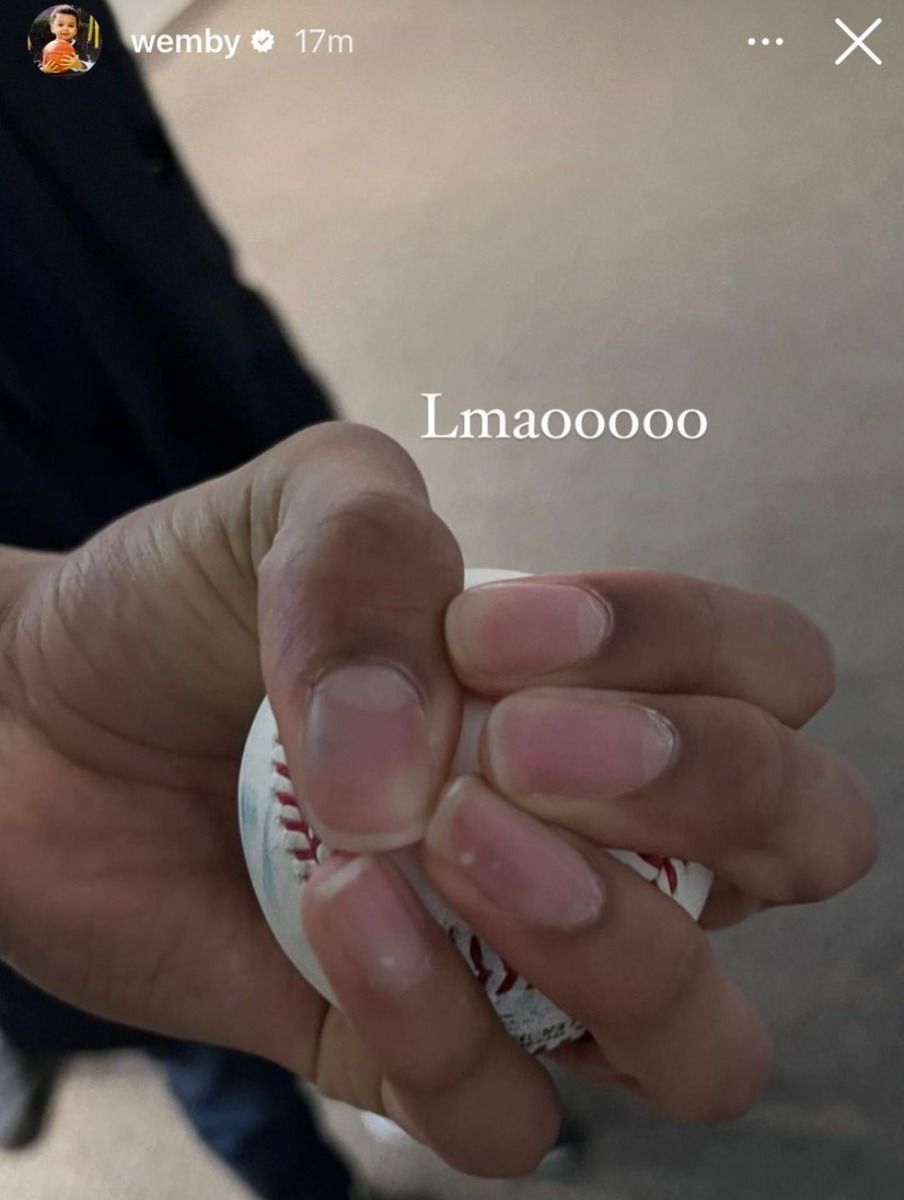 Victor Wembanyama holds a baseball in a 2023 Instagram story